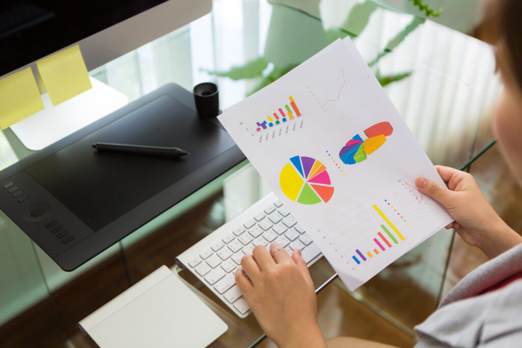 Business woman working in office with financial diagram